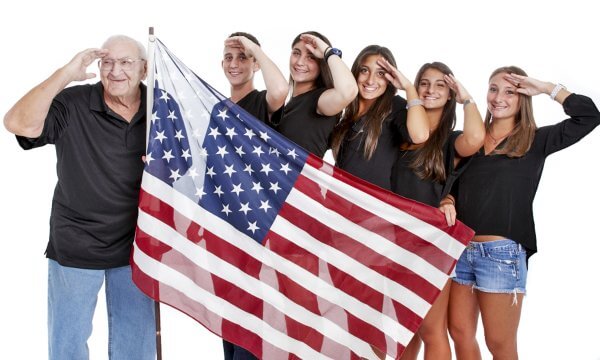 Grandfather with grandchildren and american flag